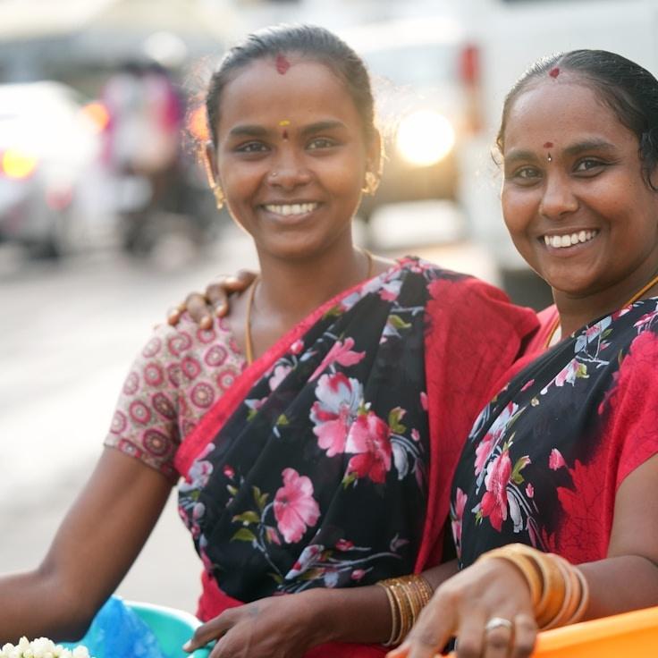 Kaveri Mehta, Lead Design Curator at SolaRinoVatrix, reviewing corporate floral arrangements